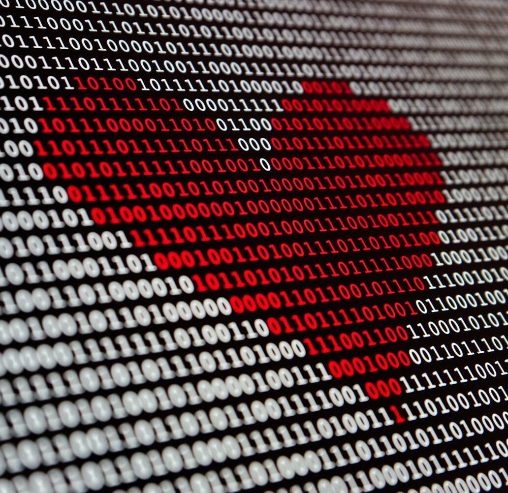 Eine digitale Herz-Darstellung einer binären Codefolge.
